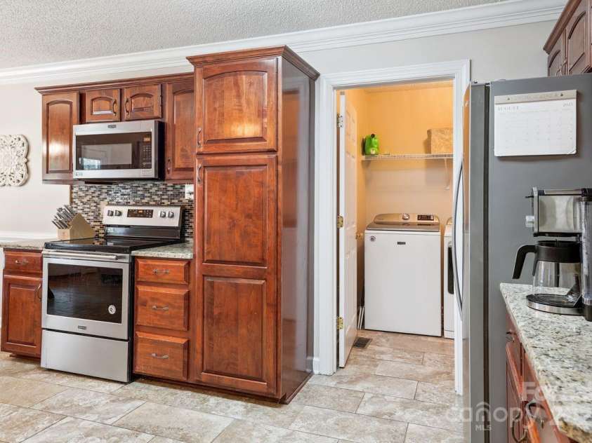 8300 Quail Hollow Drive, Harrisburg, NC 28075.  MLS# CAR4295062, YatesRealty ID 34726. Back Entrance.