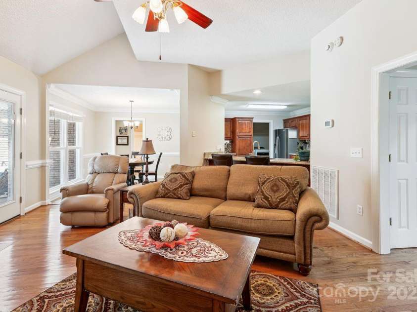8300 Quail Hollow Drive, Harrisburg, NC 28075.  MLS# CAR4295062, YatesRealty ID 34726. Family room with hardwood floors.