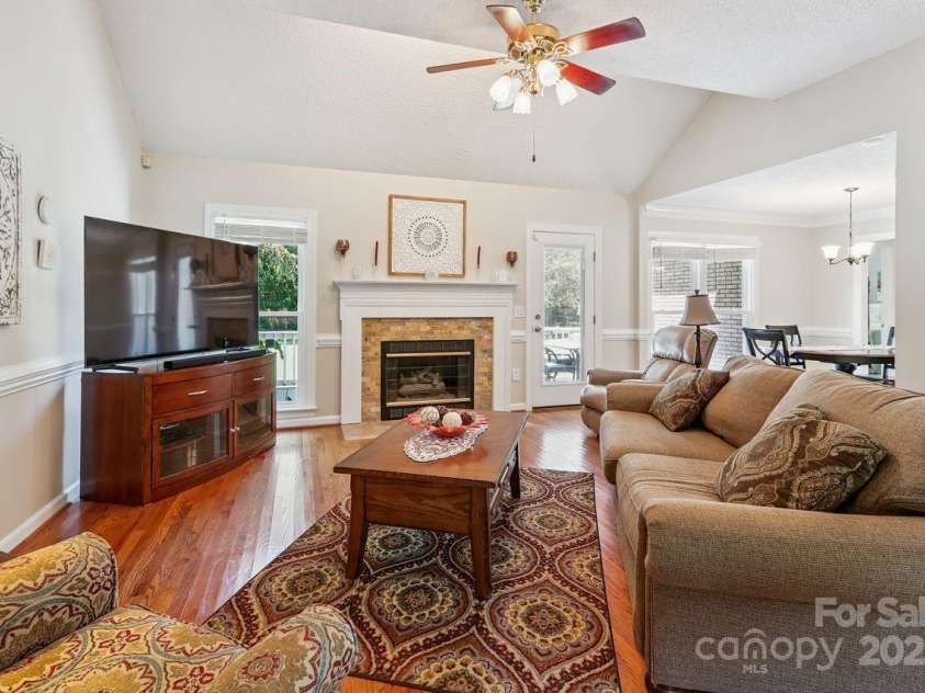 8300 Quail Hollow Drive, Harrisburg, NC 28075.  MLS# CAR4295062, YatesRealty ID 34726. Fireplace in Family Room.
