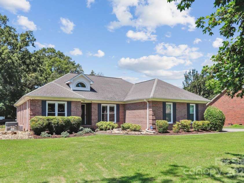 8300 Quail Hollow Drive, Harrisburg, NC 28075.  MLS# CAR4295062, YatesRealty ID 34726. Front of Home long range view.