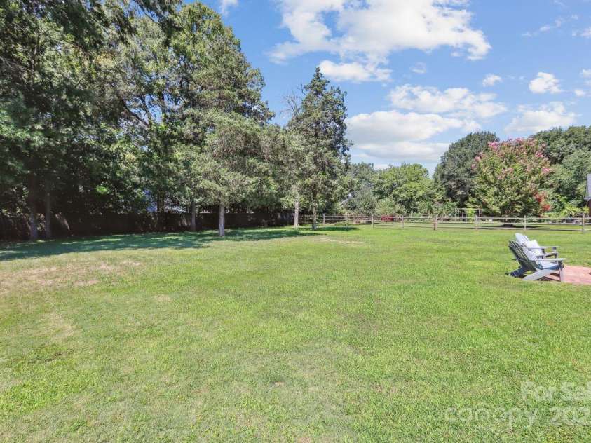 8300 Quail Hollow Drive, Harrisburg, NC 28075.  MLS# CAR4295062, YatesRealty ID 34726. Large 1/2 acre lot.