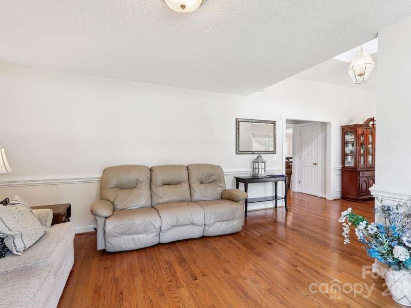 8300 Quail Hollow Drive, Harrisburg, NC 28075.  MLS# CAR4295062, YatesRealty ID 34726. Living Room.