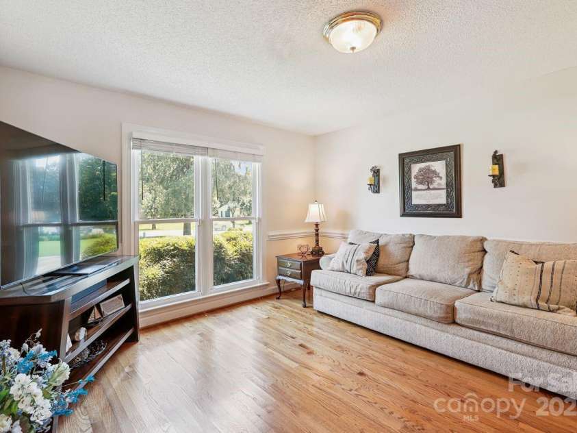 8300 Quail Hollow Drive, Harrisburg, NC 28075.  MLS# CAR4295062, YatesRealty ID 34726. Living Room with hardwood floors.