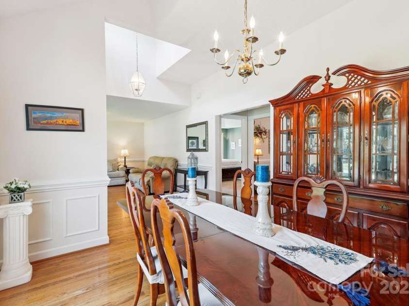 8300 Quail Hollow Drive, Harrisburg, NC 28075.  MLS# CAR4295062, YatesRealty ID 34726. Open to Dining Room.