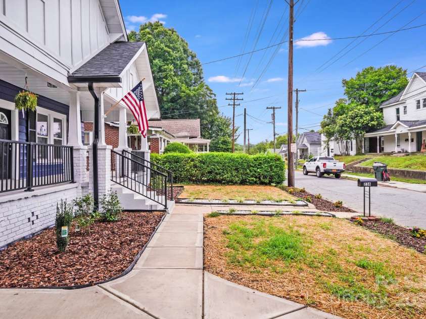 238 Academy Avenue, Concord, NC 28025.  MLS# CAR4280735, YatesRealty ID 34729. Side Profile of porch + yard