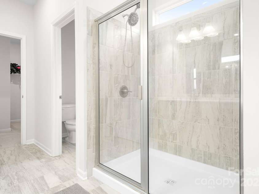 12928 Aberdeen Park Drive, Huntersville, NC 28078.  MLS# CAR4325509, YatesRealty ID 3473. Oversized Shower in Primary Bathroom. 