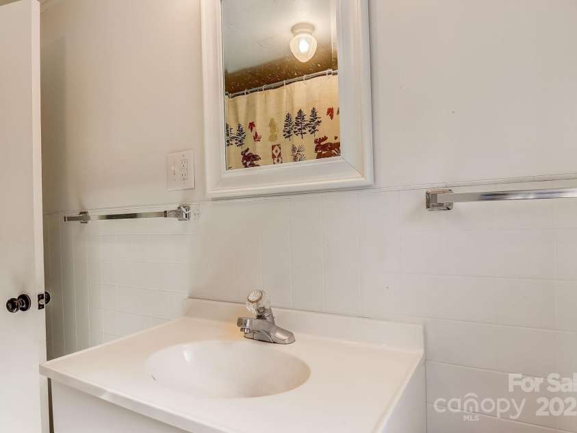 1639 Soco Road, Maggie Valley, NC 28751.  MLS# CAR4214024, YatesRealty ID 3473. Hall Bathroom