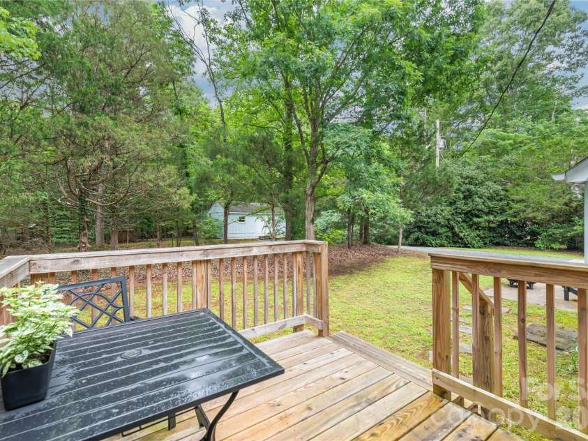 7012 Knotty Pine Road, Waxhaw, NC 28173.  MLS# CAR4388144, YatesRealty ID 34730. Backdeck that looks out on to the 1.6 acres. 