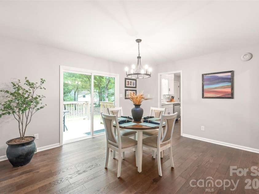 7012 Knotty Pine Road, Waxhaw, NC 28173.  MLS# CAR4388144, YatesRealty ID 34730. Large dining room with new sliding doors to the deck.  Note the beautiful floors and fresh paint.