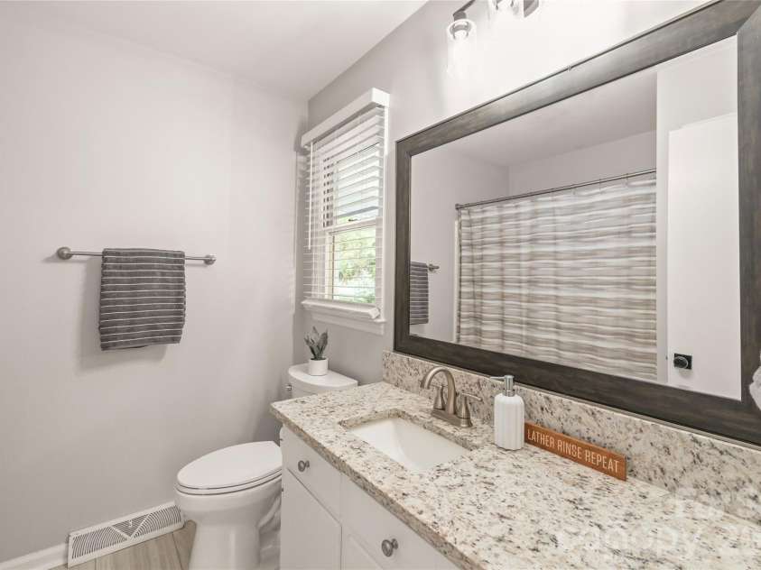 7012 Knotty Pine Road, Waxhaw, NC 28173.  MLS# CAR4388144, YatesRealty ID 34730. Light and bright on-suite bathroom. 