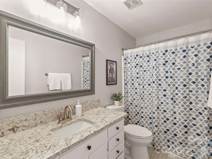 7012 Knotty Pine Road, Waxhaw, NC 28173.  MLS# CAR4388144, YatesRealty ID 34730. Upstairs bathroom.