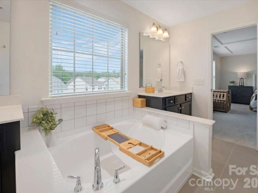 17534 Austins Creek Drive, Charlotte, NC 28278.  MLS# CAR4388620, YatesRealty ID 34731. A soaker tub that does not need much introduction — just hot water, a good book, and absolutely nowhere else to be. This is the kind of tub you buy a house for.