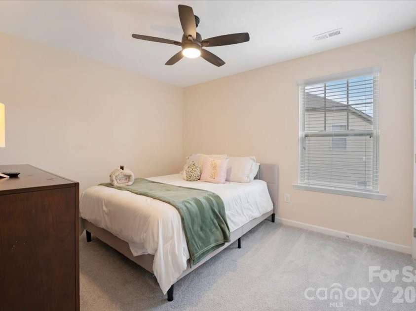 17534 Austins Creek Drive, Charlotte, NC 28278.  MLS# CAR4388620, YatesRealty ID 34731. A third secondary bedroom that is every bit as well considered as the others — comfortable, light filled, and ready for whatever your household needs it to become.