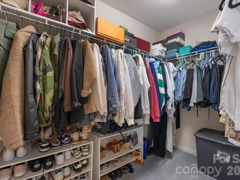 17534 Austins Creek Drive, Charlotte, NC 28278.  MLS# CAR4388620, YatesRealty ID 34731. Closet one of two. Generous. Organized. Entirely yours. The search for a primary suite that actually respects your wardrobe ends right here.