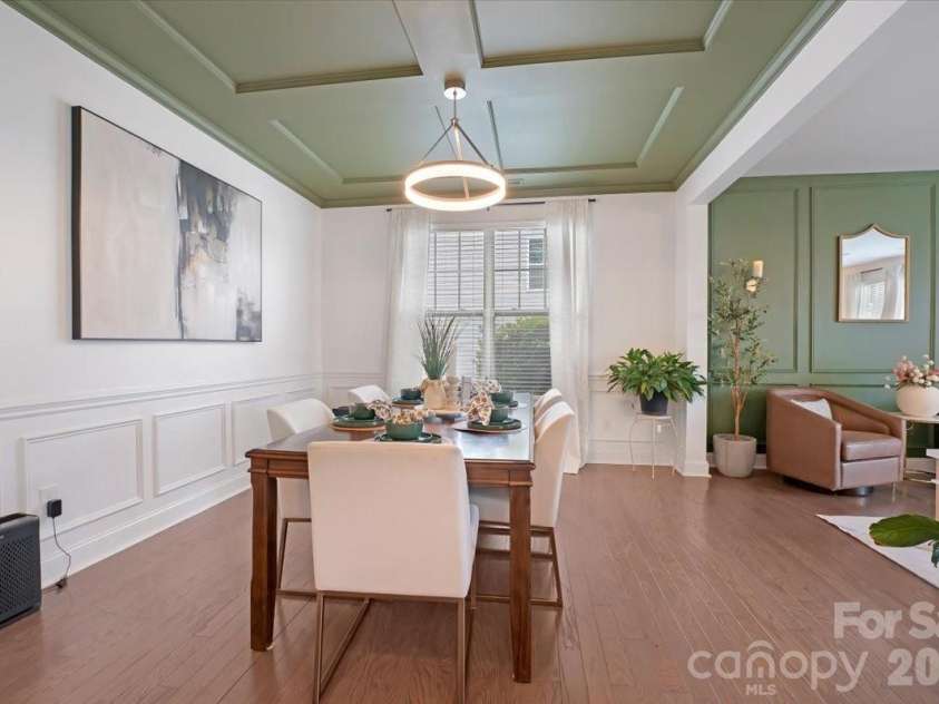 17534 Austins Creek Drive, Charlotte, NC 28278.  MLS# CAR4388620, YatesRealty ID 34731. Coffered ceiling. Wainscoting. Hardwood floors. The dining room in this home has more character in its trim work alone than most homes have anywhere. 