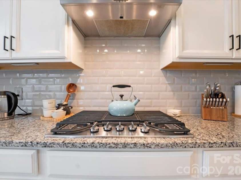 17534 Austins Creek Drive, Charlotte, NC 28278.  MLS# CAR4388620, YatesRealty ID 34731. Five burners. Gas. Enough said — but just in case — this is the cooktop that makes people excited to cook dinner on a Wednesday night.