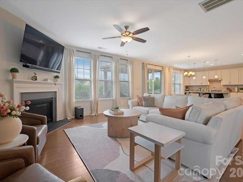 17534 Austins Creek Drive, Charlotte, NC 28278.  MLS# CAR4388620, YatesRealty ID 34731. From the living room you can see straight through to the kitchen and breakfast space — a view that tells you everything about how this home was designed to live. Open, connected, and warm in every direction you l