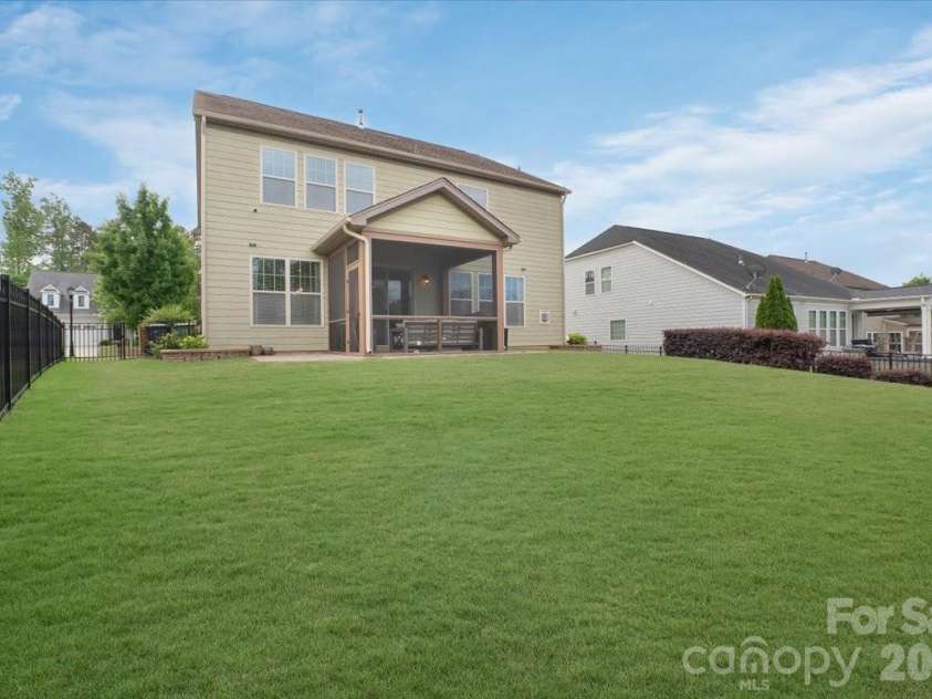17534 Austins Creek Drive, Charlotte, NC 28278.  MLS# CAR4388620, YatesRealty ID 34731. Same great screened porch. New angle. Vaulted ceiling that makes the whole space soar. This is outdoor living done with intention — and it shows from every direction you look at it.