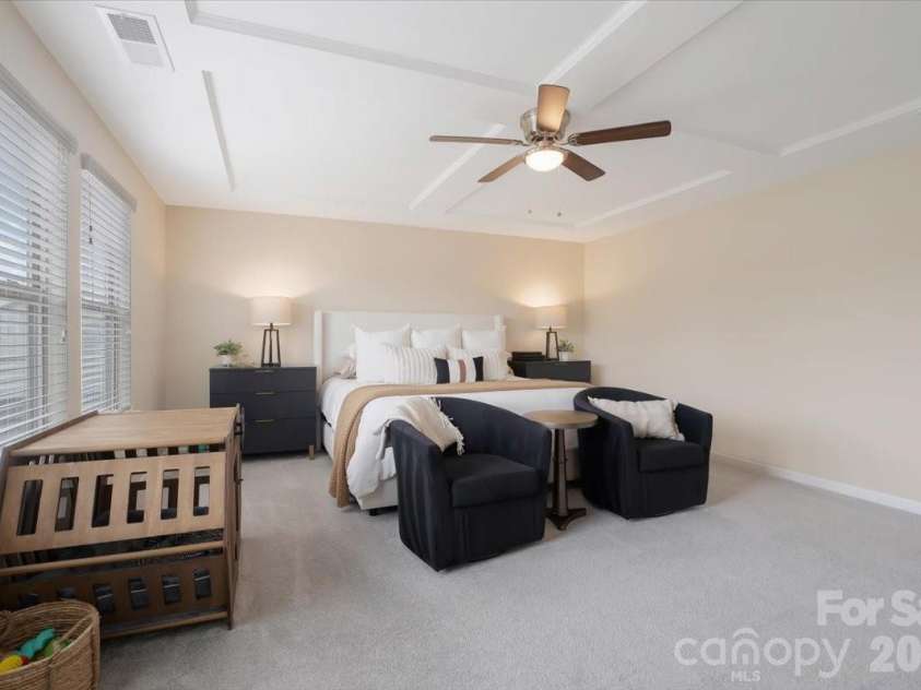 17534 Austins Creek Drive, Charlotte, NC 28278.  MLS# CAR4388620, YatesRealty ID 34731. The primary bedroom is the exclamation point at the end of an already impressive floor plan. Huge, sun-drenched, and designed with the kind of scale and light that makes every morning feel like a fresh start.