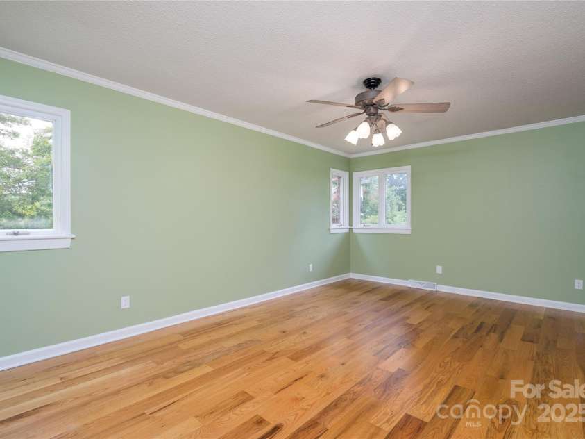 5486 Highway 27 Highway, Iron Station, NC 28080.  MLS# CAR4283380, YatesRealty ID 34732. Expansive Primary Bedroom