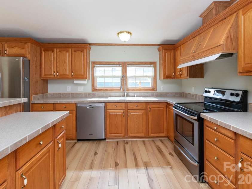 71 Teachers Lane, Canton, NC 28716.  MLS# CAR4394186, YatesRealty ID 34734. Spacious kitchen with ample counter space, abundant cabinet storage, and newer appliances.