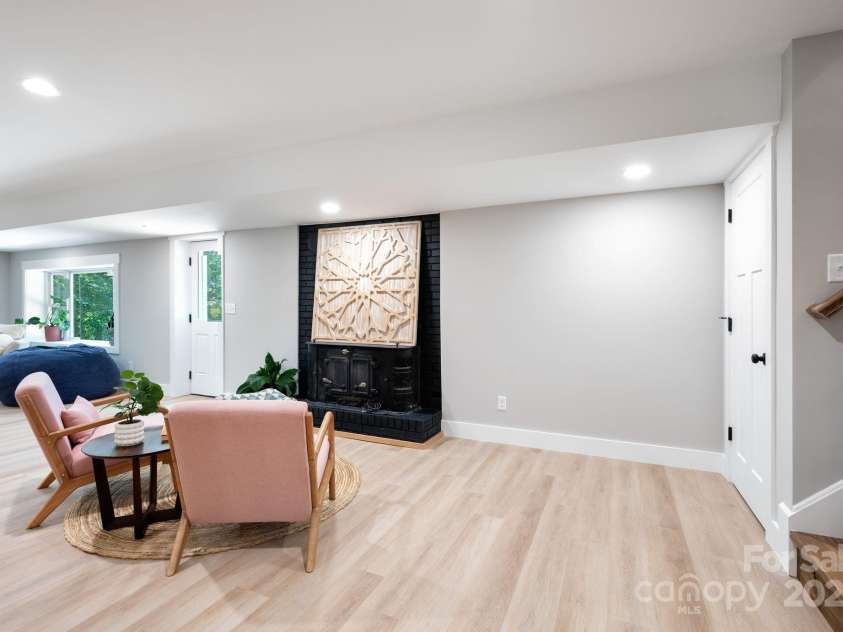 15 Pine Ridge Court, Fletcher, NC 28732.  MLS# CAR4292074, YatesRealty ID 34739. Second Wood Stove Fireplace in Lower Level Basement