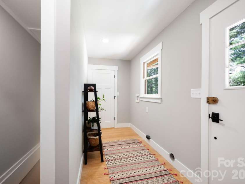 15 Pine Ridge Court, Fletcher, NC 28732.  MLS# CAR4338257, YatesRealty ID 34739. Laundry Room with Convenient Basement and Exterior Access