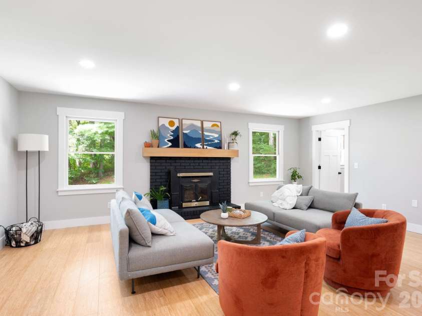 15 Pine Ridge Court, Fletcher, NC 28732.  MLS# CAR4338257, YatesRealty ID 34739. Open Living Space with Wood Stove Fireplace
