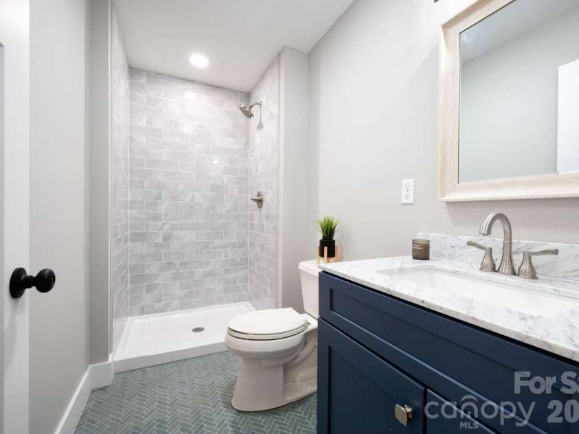 15 Pine Ridge Court, Fletcher, NC 28732.  MLS# CAR4338257, YatesRealty ID 34739. Second Full Main Level Bathroom