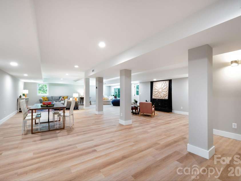 15 Pine Ridge Court, Fletcher, NC 28732.  MLS# CAR4338257, YatesRealty ID 34739. Versatile and Spacious Basement Area, Perfect for Entertaining