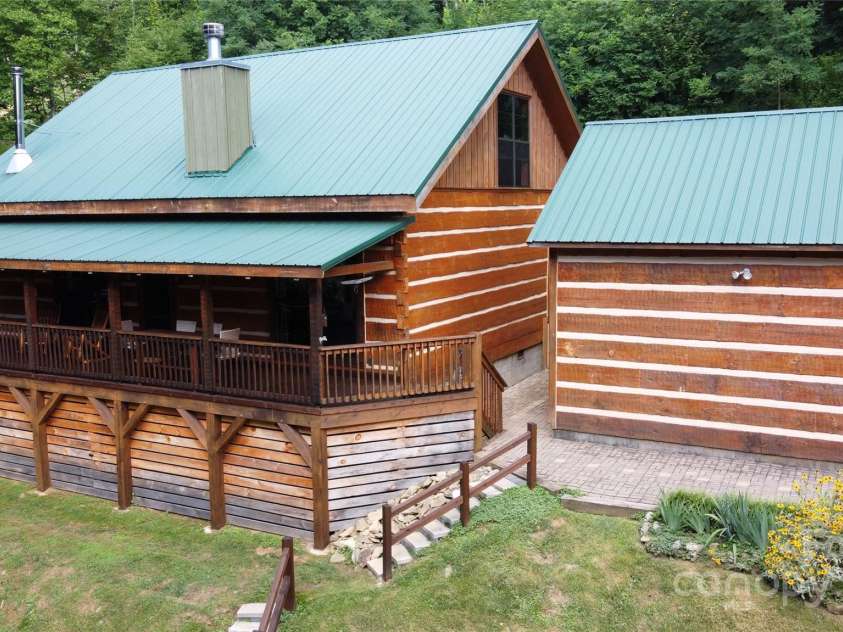 120 Spotted Fawn Lane, Waynesville, NC 28785.  MLS# CAR4284528, YatesRealty ID 34742. Drone photo of the home and garage