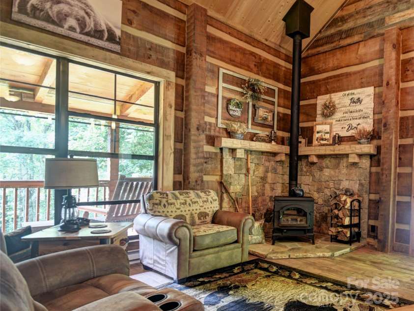 120 Spotted Fawn Lane, Waynesville, NC 28785.  MLS# CAR4284528, YatesRealty ID 34742. Efficient wood stove for cool mountain evenings