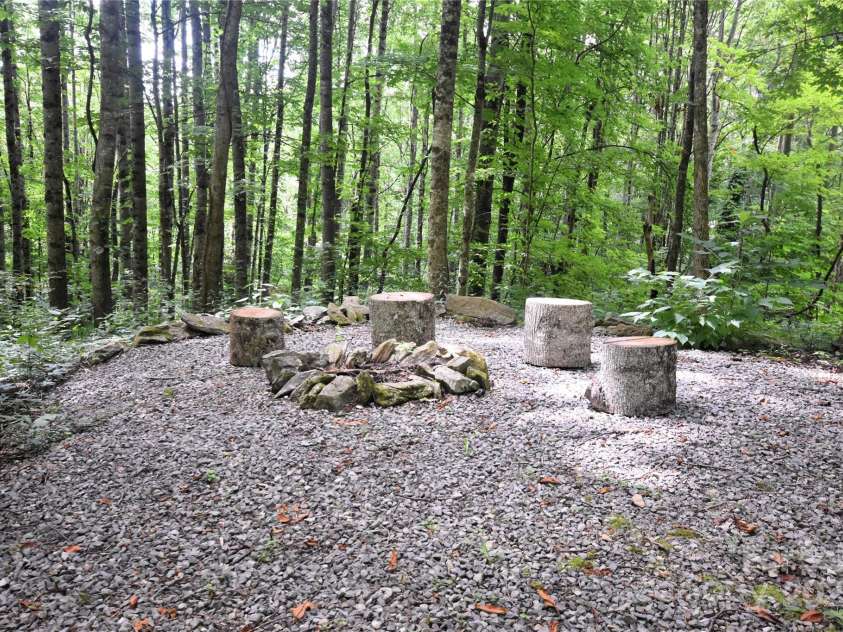 120 Spotted Fawn Lane, Waynesville, NC 28785.  MLS# CAR4284528, YatesRealty ID 34742. Firepit area for socializing by an open fire