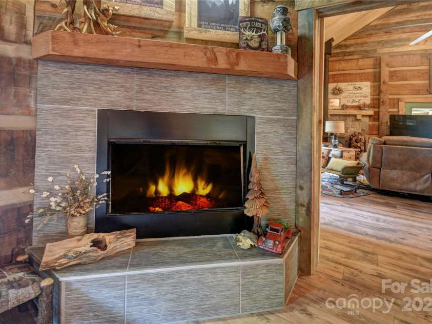 120 Spotted Fawn Lane, Waynesville, NC 28785.  MLS# CAR4284528, YatesRealty ID 34742. Fireplace in the primary bedroom (simulated flames)
