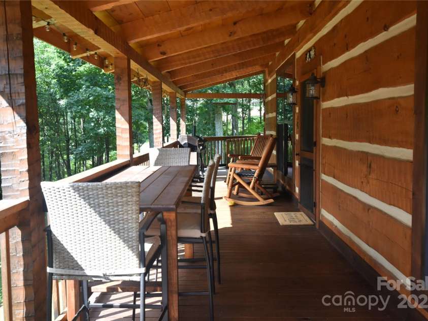 120 Spotted Fawn Lane, Waynesville, NC 28785.  MLS# CAR4284528, YatesRealty ID 34742. Large, covered front deck/ porch