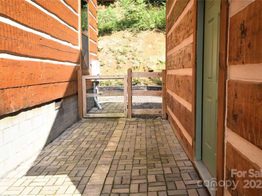 120 Spotted Fawn Lane, Waynesville, NC 28785.  MLS# CAR4284528, YatesRealty ID 34742. Pavers between the garage and home