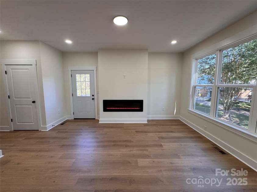 3920 Cherry Grove Drive, Hickory, NC 28602.  MLS# CAR4296832, YatesRealty ID 34750. Living room with electric fireplace.