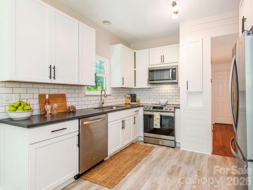 1300 Copper Creek Lane, Fort Mill, SC 29715.  MLS# CAR4392072, YatesRealty ID 34752. Kitchen with beautiful Corian counters