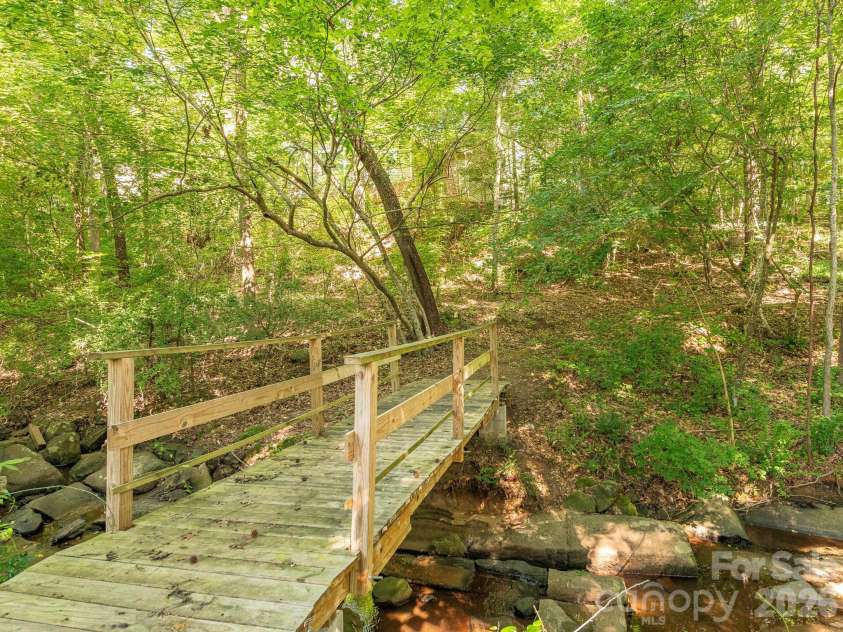 1300 Copper Creek Lane, Fort Mill, SC 29715.  MLS# CAR4392072, YatesRealty ID 34752. This bridge is picture perfect, take your family photos
