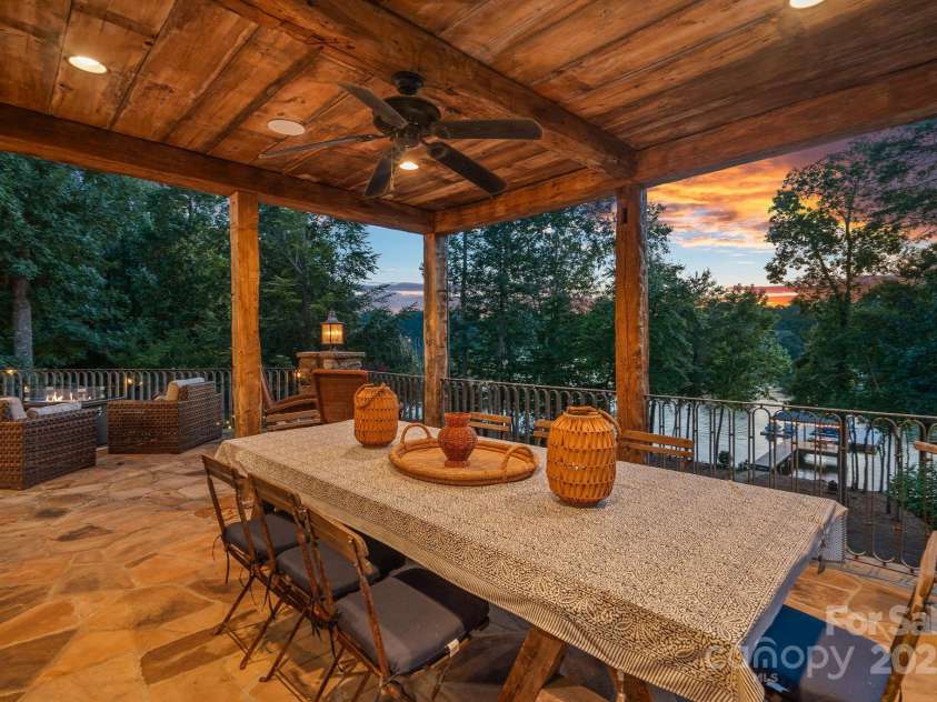 6821 Pebble Bay Drive, Denver, NC 28037.  MLS# CAR4292691, YatesRealty ID 34754. 2nd story stone veranda overlooking the lake