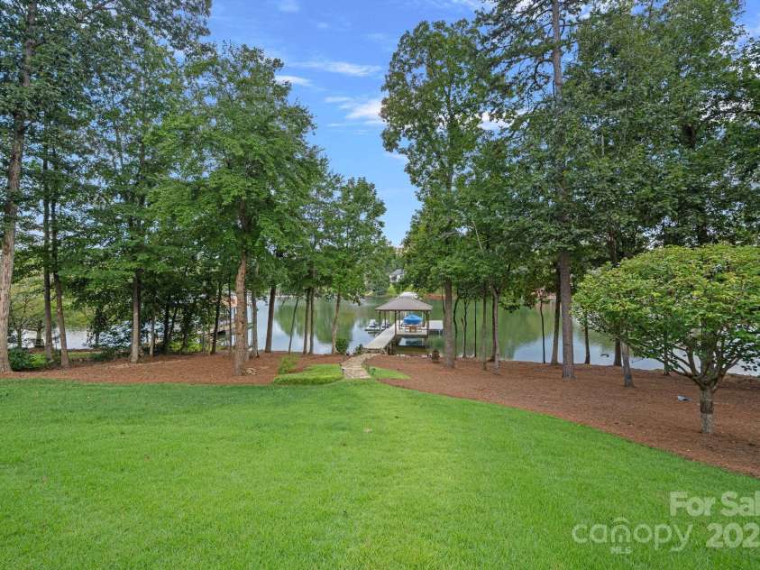 6821 Pebble Bay Drive, Denver, NC 28037.  MLS# CAR4292691, YatesRealty ID 34754. Flat and open backyard perfect for yard games