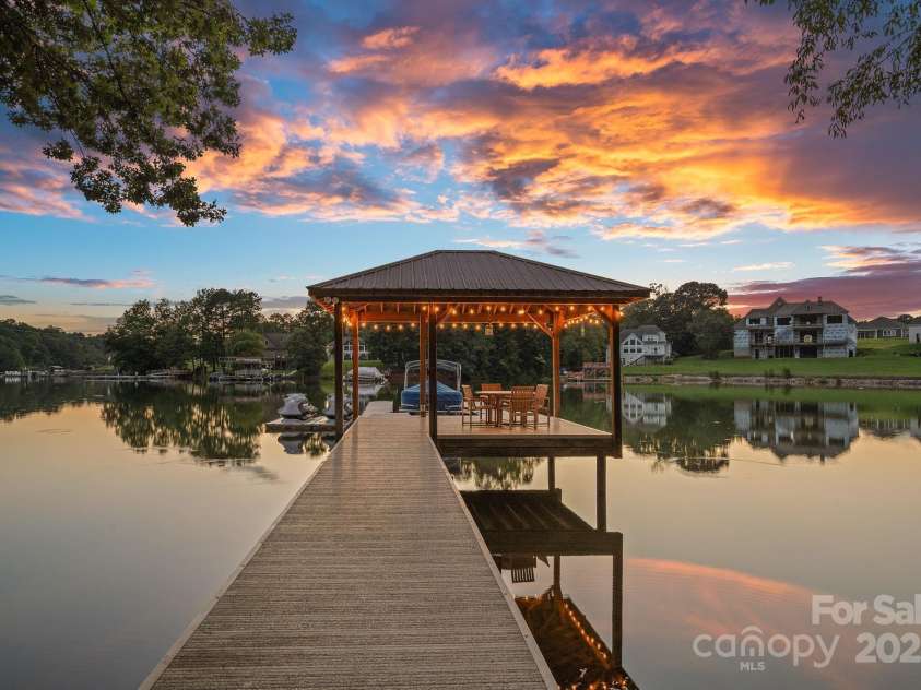 6821 Pebble Bay Drive, Denver, NC 28037.  MLS# CAR4292691, YatesRealty ID 34754. Pier with floating boatslip, covered sitting area and 2 jet-ski ports