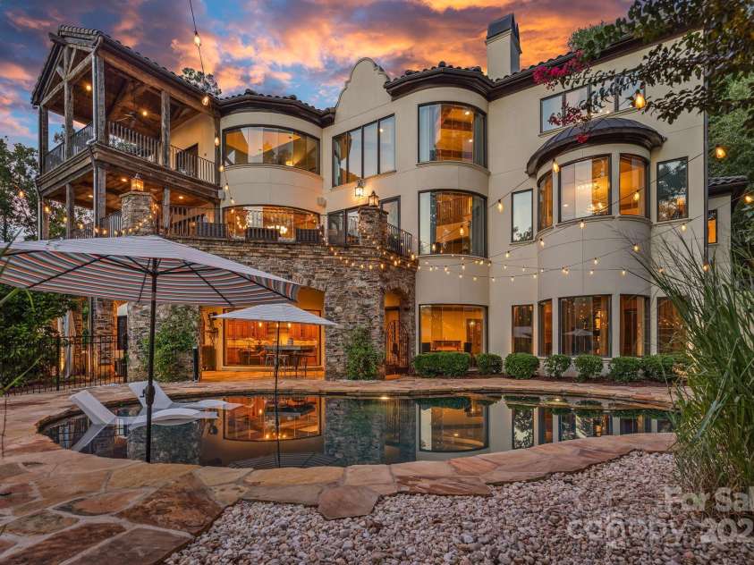 6821 Pebble Bay Drive, Denver, NC 28037.  MLS# CAR4292691, YatesRealty ID 34754. Pool and back twilight