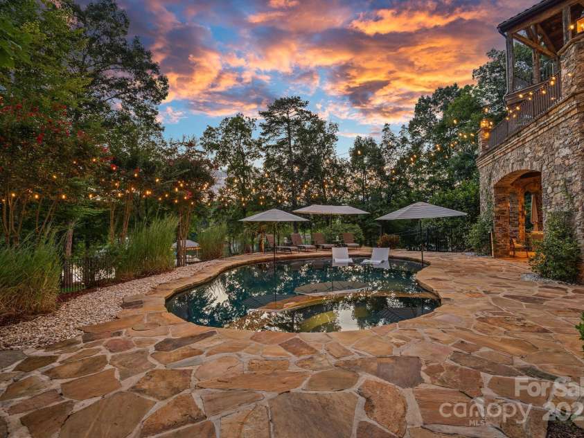 6821 Pebble Bay Drive, Denver, NC 28037.  MLS# CAR4292691, YatesRealty ID 34754. Pool & spa with stone pool deck
