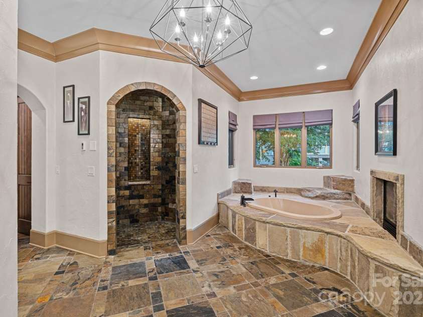 6821 Pebble Bay Drive, Denver, NC 28037.  MLS# CAR4292691, YatesRealty ID 34754. Primary Bath with stone floors and seperate soaking tub