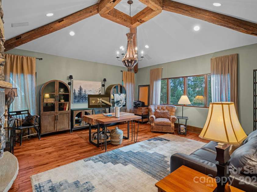 6821 Pebble Bay Drive, Denver, NC 28037.  MLS# CAR4292691, YatesRealty ID 34754. Private home office with stone fireplace, lake views and re-claimed wood detail.