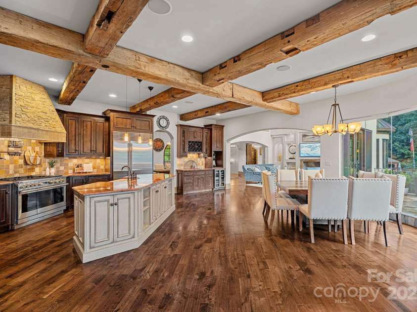 6821 Pebble Bay Drive, Denver, NC 28037.  MLS# CAR4292691, YatesRealty ID 34754. Spacious kitchen and breakfast area flanked with reclaimed wood beams
