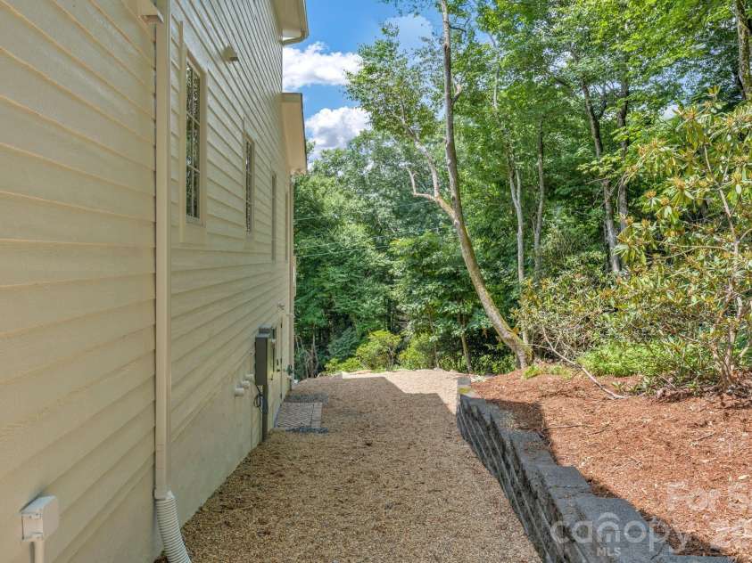 253 Old Boone Road, Blowing Rock, NC 28605.  MLS# CAR4397226, YatesRealty ID 34758. Path to golf cart storage