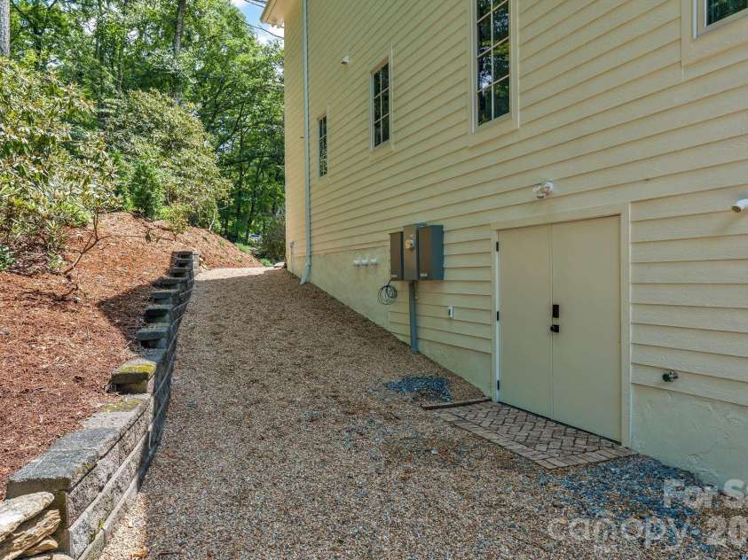 253 Old Boone Road, Blowing Rock, NC 28605.  MLS# CAR4397226, YatesRealty ID 34758. Path to golf cart storage