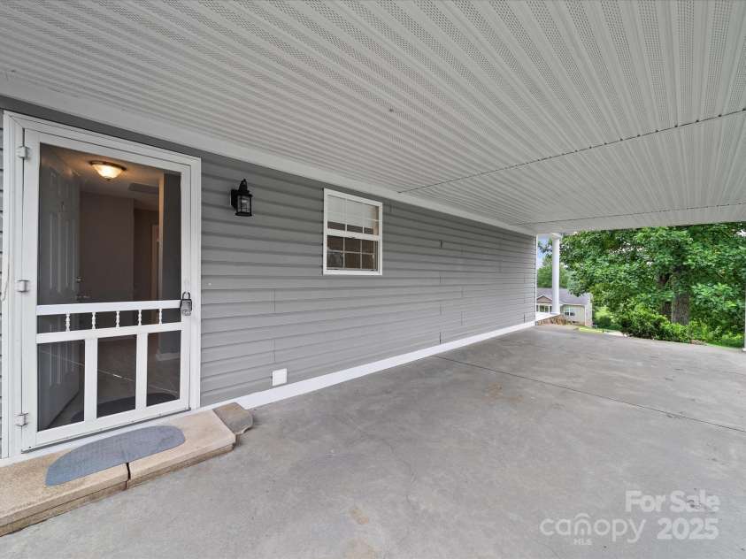 1585 Nathanial Street, Newton, NC 28658.  MLS# CAR4289013, YatesRealty ID 34764. Large covered car port